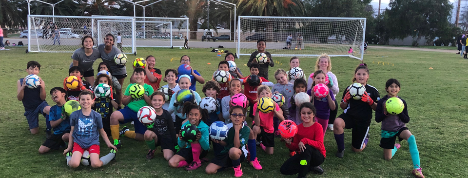 OJSC soccer camp players together on the field